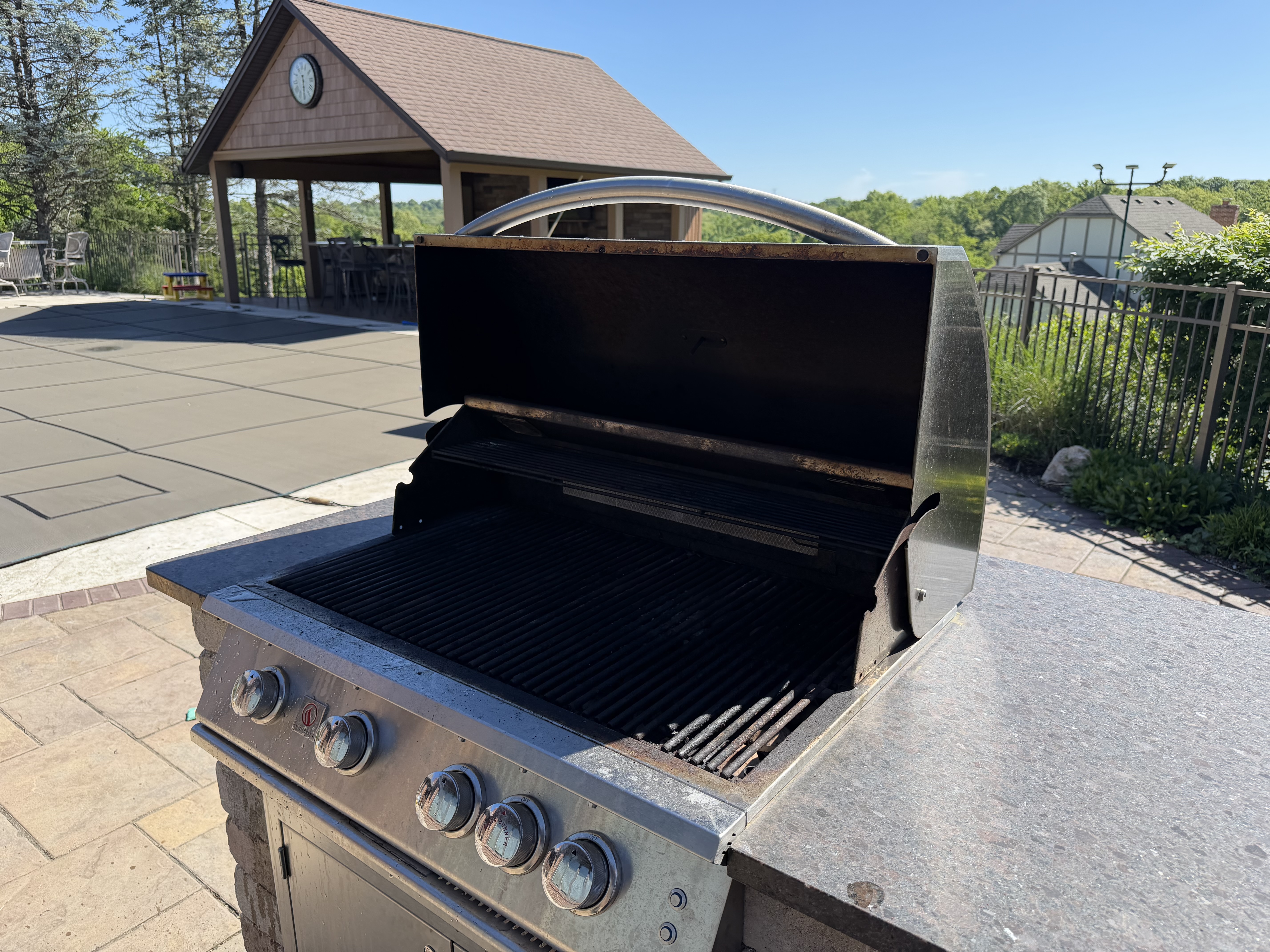 Before: 5-burner built-in grill at a stone island with carbonized buildup on the grates and grease on the cookbox